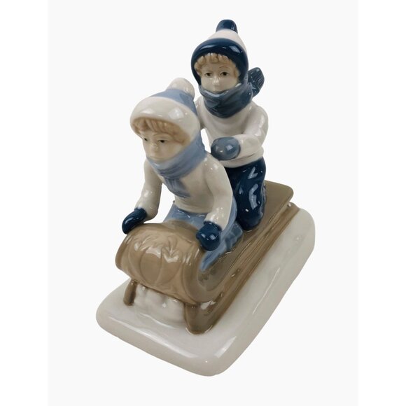Paul Sebastian Kid Sledding Glazed Figurine Winter Holiday Collectible Decor - Picture 1 of 9